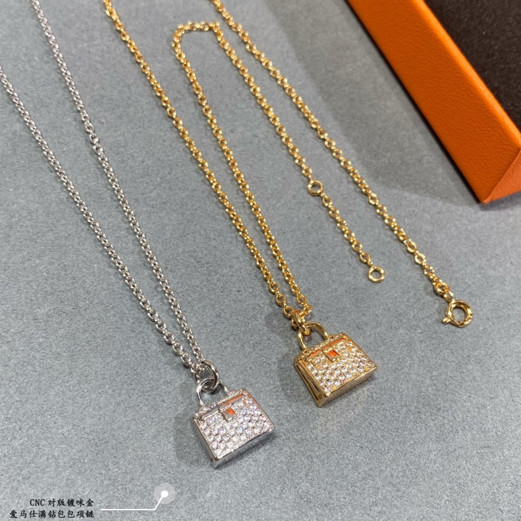 H**me5 fully di*m*nd-encrusted bag necklace