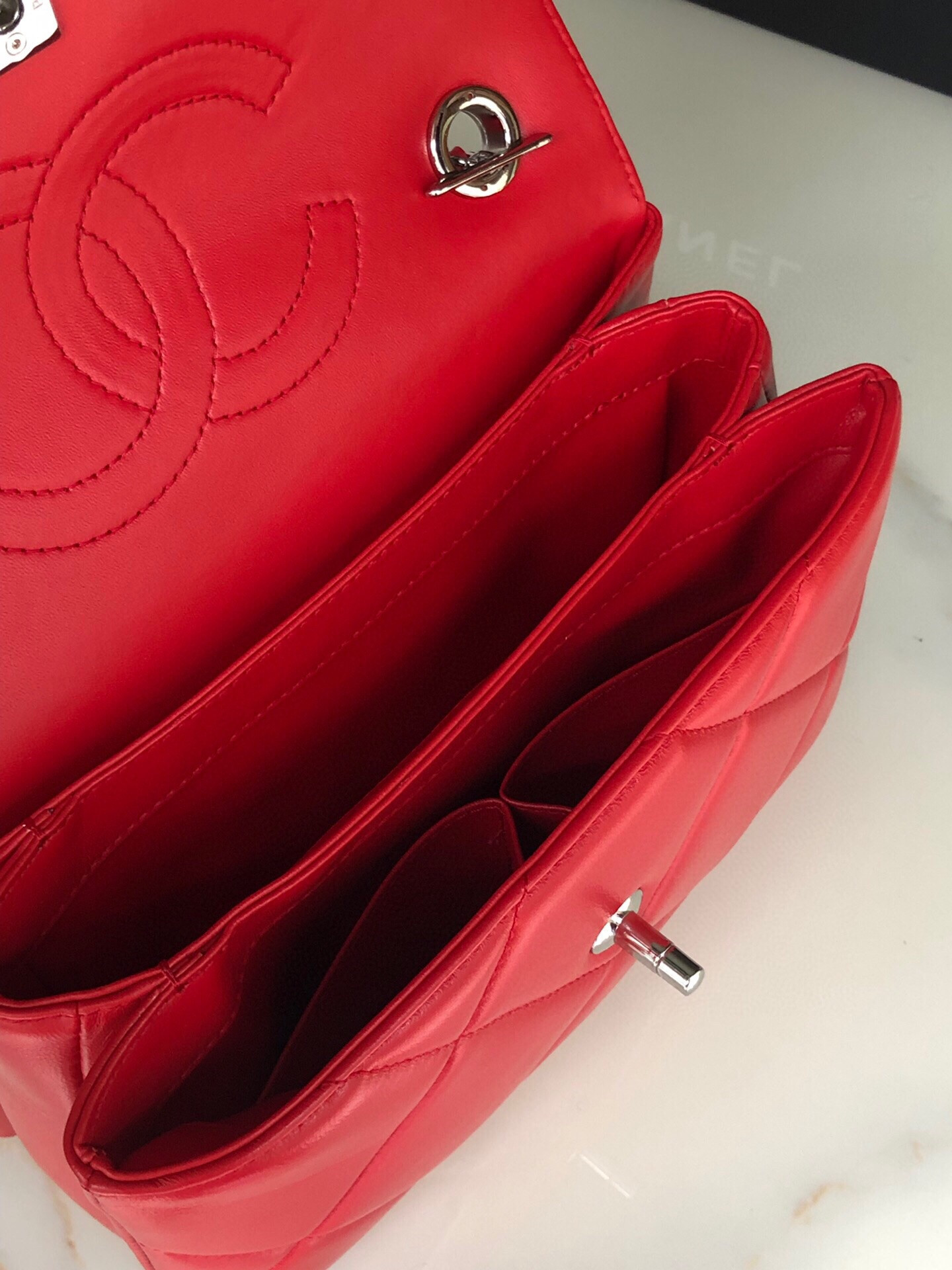 Ch*el flap bag with top handle 6.6 × 9.8 × 4.7 in